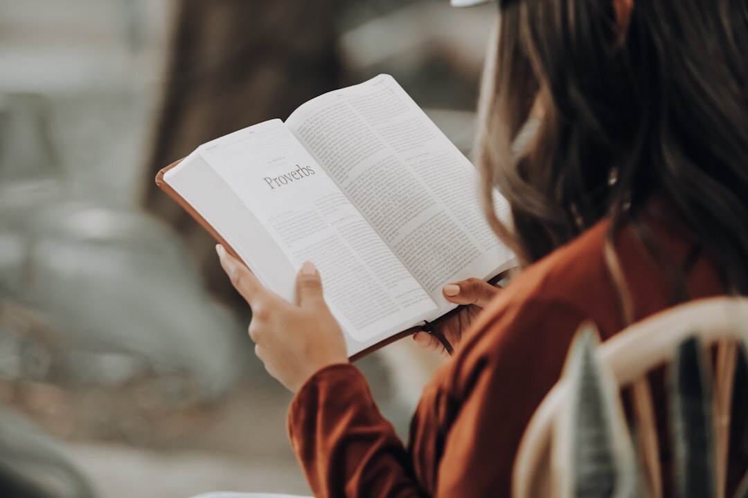 woman reading mystery novel